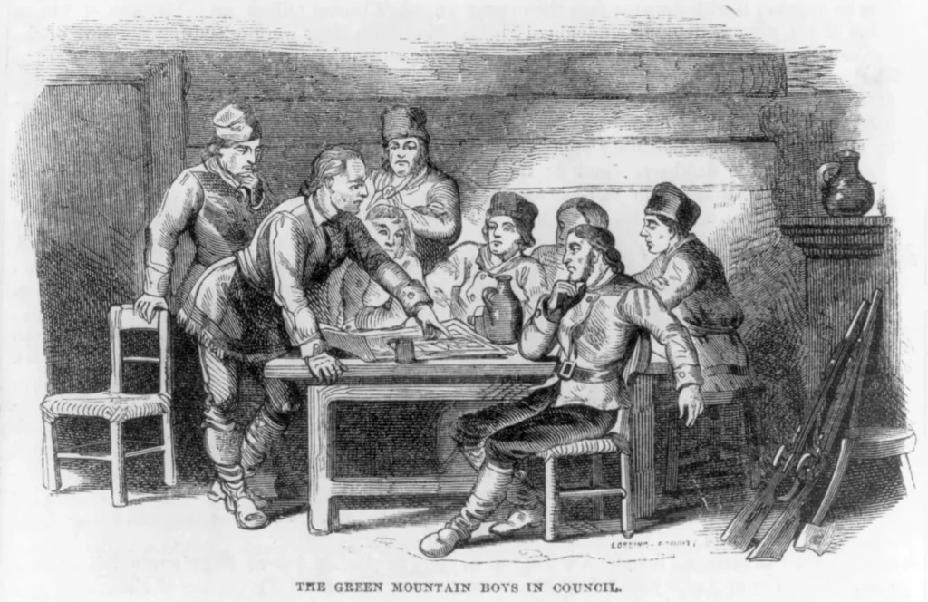 A vintage 1858 black and white wood engraving titled 'The Green Mountain Boys in Council', depicting Ethan Allen standing at a wooden table and pointing at a map while consulting with a group of early American colonial militia fighters inside a log cabin.