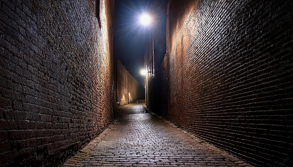 n historic dark alleyway in colonial Philadelphia at night, lit by a single lantern, representing the secret patrols of the Midnight Mechanics.